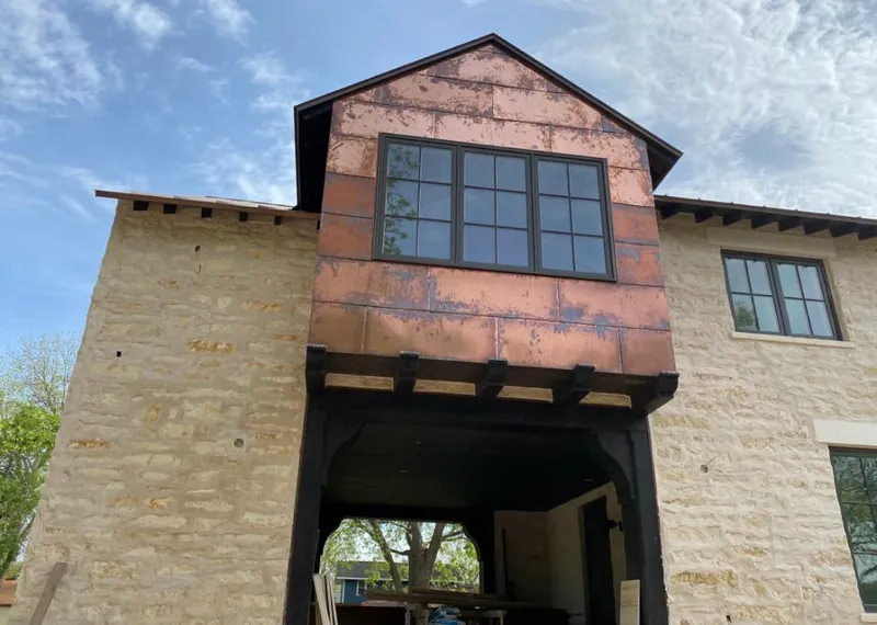 Copper metal panel facade on a stone building for Skylight Installation in Withamsville